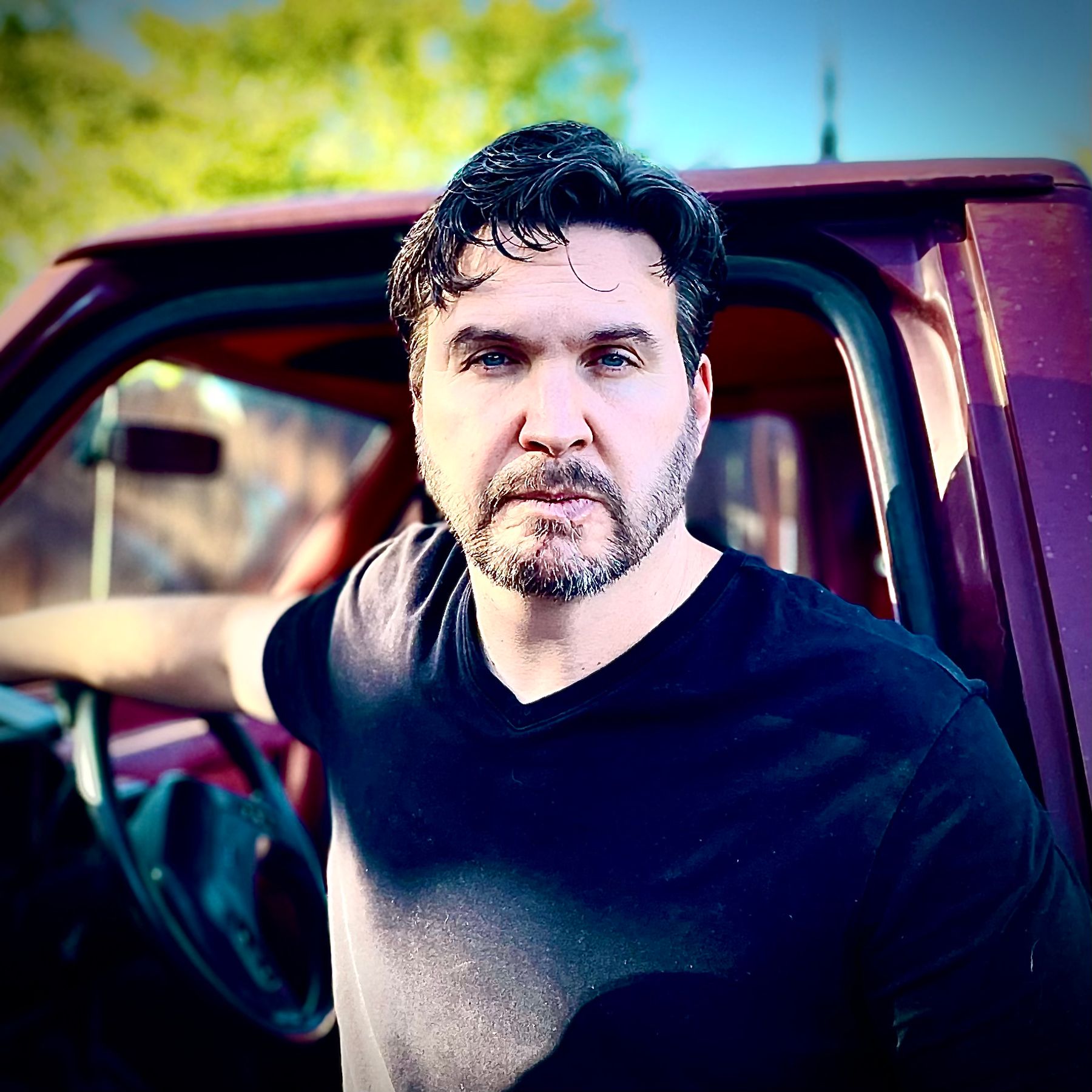 Joshua Ingram beside his truck